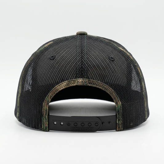 rucker hat shown from the back, featuring a black mesh back, camouflage-patterned brim and edge trim, and a black adjustable snap strap. alternate view