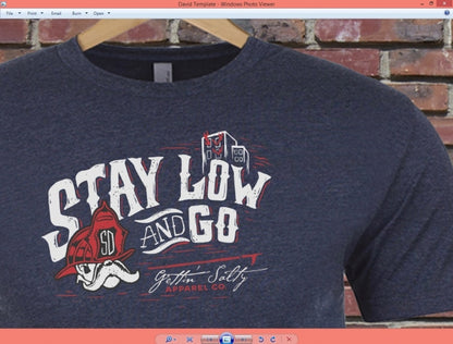 Navy blue sweatshirt with 'Stay Low and Go' graphic design on a brick wall background