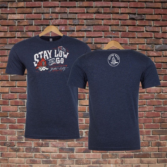 Navy blue t-shirt with text and graphics on a brick wall background
