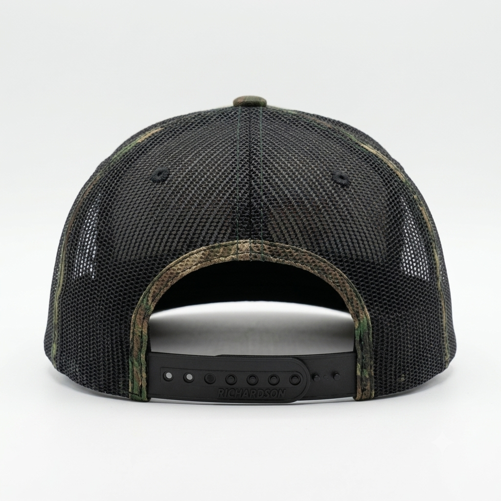 rucker hat shown from the back, featuring a black mesh back, camouflage-patterned brim and edge trim, and a black adjustable snap strap.