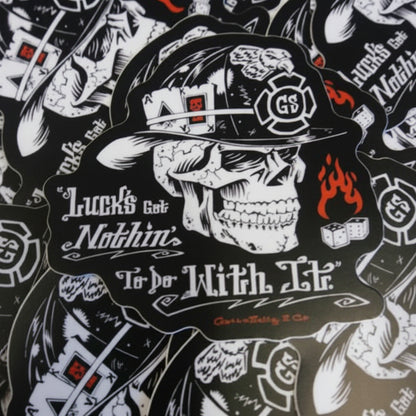 Sticker with skull wearing a helmet and text on a black background "Luck's Got Nothing To Do with it"