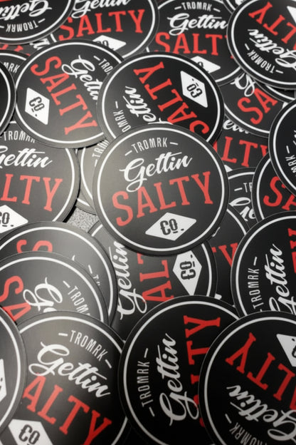 Pattern of 'Gettin Salty' stickers with red and black text on a gray background.