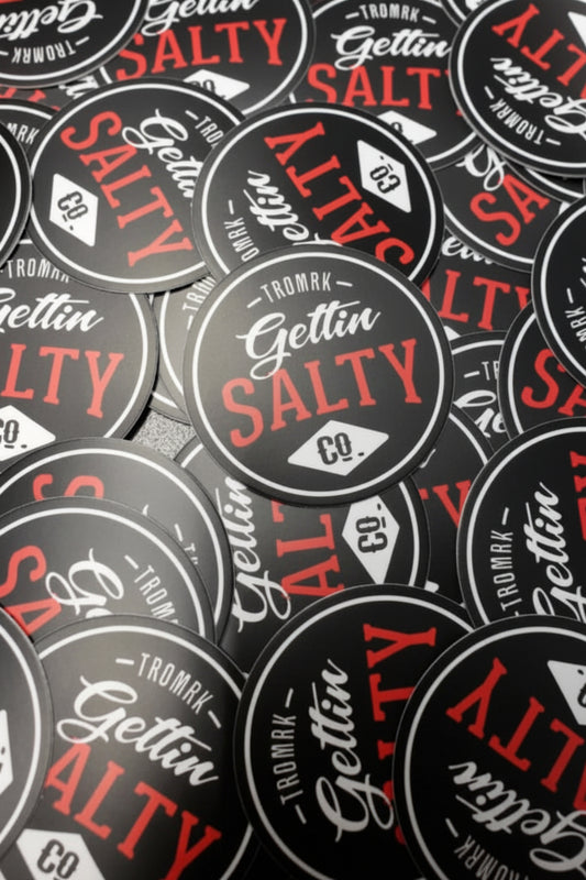 Pattern of 'Gettin Salty' stickers with red and black text on a gray background.