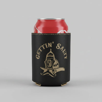 Red can in a black can cooler with 'Gettin' Salty' branding on a bar counter.