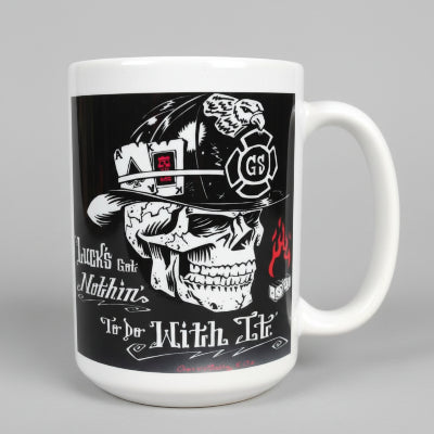 Mug with skull design and text on a wooden surface